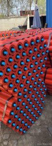 Which idler roller construction suits a mineral processing plant with abrasive dust and heavy impact