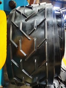 Balancing Material Fit and Procurement Cost in Wet Outdoor Conveyor Belt Selection